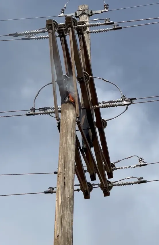 Utility pole fire illustrating the hazards addressed by pole inspections